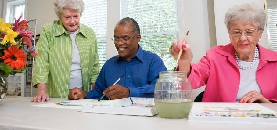 Older people in a painting class.